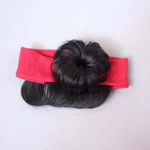 Detail of red knit headband with black synthetic fiber hair buns for baby girls