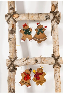 Detailed view of four wooden gingerbread man ornaments hanging on a birch ladder