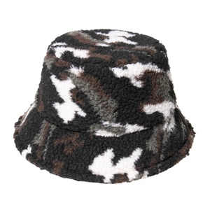 Close-up detail of warm fleece camo bucket hat with soft lamb wool texture for winter