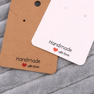 Brown and white paper earring display cards with Handmade With Love heart print
