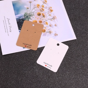 Brown and white kraft paper earring display cards featuring Handmade with love text