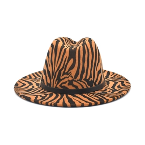 Stylish orange zebra print fedora hat with a wide brim and decorative black band