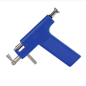 Detail view of the ergonomic blue piercing tool with stainless steel gun head assembly