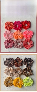 Detail showing the soft texture of coral fleece velvet scrunchies in various vibrant colors