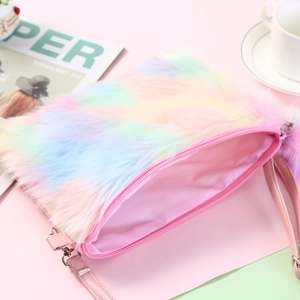 Detailed view of rainbow plush crossbody bag with pink satin lining and zipper closure