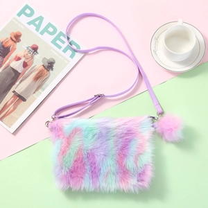 Rainbow plush crossbody bag for girls featuring colorful fur and matching pom-pom charm