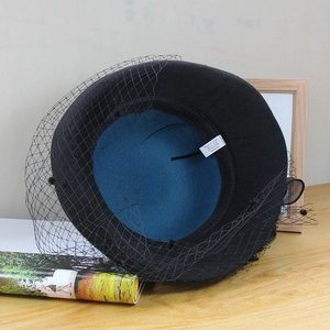 Detail of wool blend hat showing inner blue lining and material composition label
