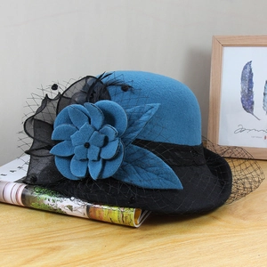 Vintage wool felt cloche hat in Klein blue with black mesh veil and 3D floral accent