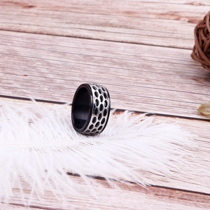 Retro punk style stainless steel ring with black and silver honeycomb hollow texture