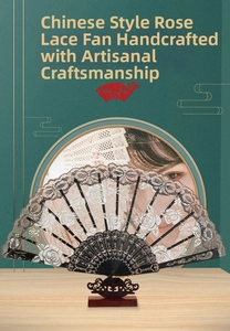 Detailed view of a black lace folding fan with white rose patterns and wood stand