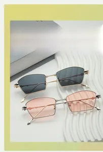 Detail of irregular geometric sunglasses with metal frames and embossed temple hinges
