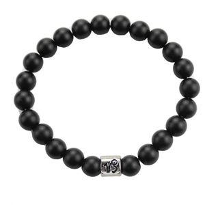 Black matte stone bead bracelet with silver Capricorn zodiac charm on white background