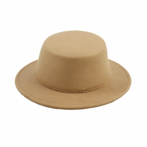 Detailed view of camel wool felt boater hat texture with flat top and straight brim