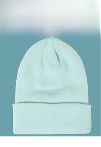 Detailed view of knitted beanie featuring vertical ribbed texture and wide folded cuff