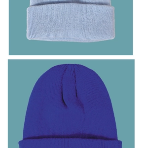Detailed knit texture of solid color beanies in light grey and royal blue tones