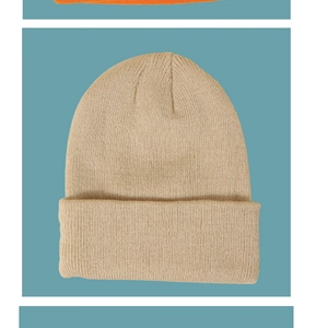 Detail of soft beige ribbed knit beanie with folded cuff for kids winter warmth