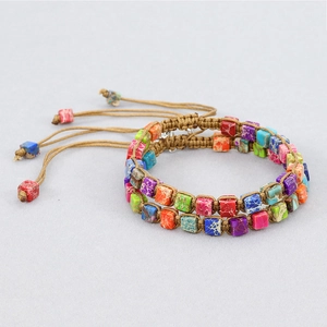 Detailed view of handmade dual-layer woven bracelet with colorful emperor stone beads