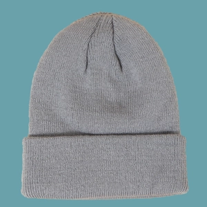 Detailed texture of gray chunky knit beanie with a stylish folded cuff for winter warmth