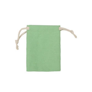 Close-up of a light green drawstring canvas pouch with textured cotton fabric