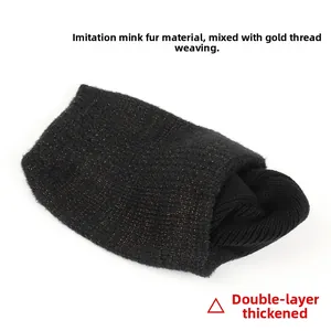 Detailed view of faux mink fur fabric with gold metallic thread and thick double lining