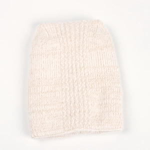 Detailed view of cream white thick ribbed knit texture on a soft winter beanie hat