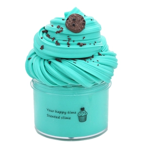 Detail of mint blue scented butter slime with cookie charms and cream swirl texture