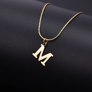 Elegant gold titanium steel necklace with M-letter pendant on a bamboo chain style