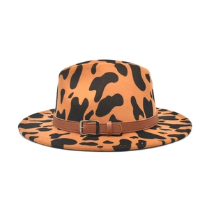 Stylish wide-brim wool fedora hat with brown cow print pattern and leather buckle band