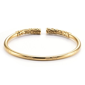 Vintage golden open cuff bracelet with intricate auspicious cloud pattern carvings