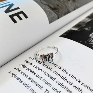 Close-up of vintage sterling silver butterfly open ring with S925 hallmark engraving