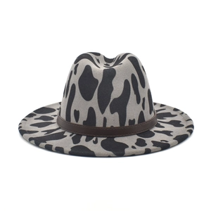Fedora hat with cow print pattern and brown leather band for men and women