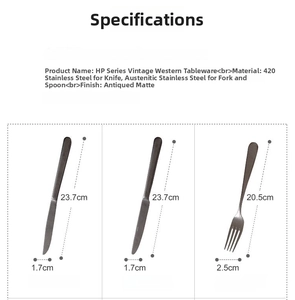 Close-up of vintage matte stainless steel steak knife and dinner fork with HP hallmark