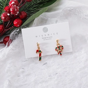 Detailed shot of Christmas candy cane and wreath earrings on 925 silver posts