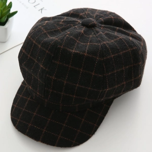 Top view of retro brown checkered newsboy cap with textured wool fabric for autumn