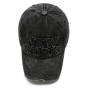 Distressed wash black denim baseball cap featuring New York embroidery and ripped details
