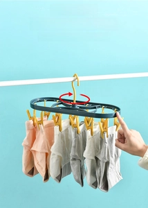 Detail showing 360-degree rotating swivel and windproof hook of plastic drying rack