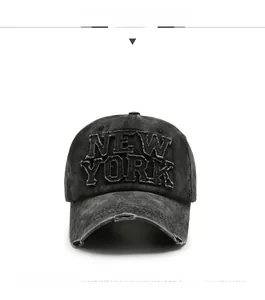 Detail of vintage washed grey baseball cap with New York embroidery and frayed edges