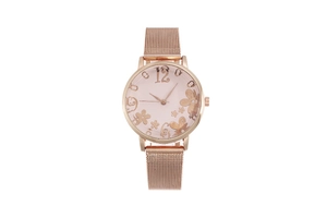 Close-up of rose gold mesh watch band with elegant pink floral dial and gold number 12