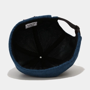 Navy blue corduroy docker cap with vintage texture and adjustable strap back
