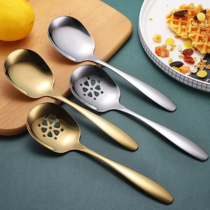 Macro detail of 304 stainless steel serving spoons in gold and silver finish