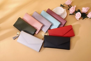 Detailed arrangement of colorful PU leather envelope wallets with heart tassel charms