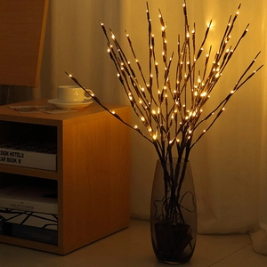 Warm white LED decorative branch lights in glass vase for cozy bedroom atmosphere