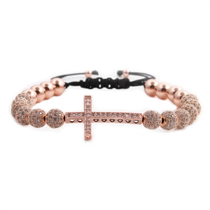 Rose gold cross bead bracelet with micro-pave cubic zirconia and adjustable black cord