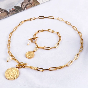 Ensemble collier et bracelet dorés à maillons trombones avec perle et arbre de vie