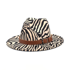 Detail of zebra pattern wool jazz fedora with brown leather belt and silver buckle