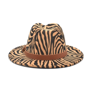 Fedora hat with zebra animal print and brown faux leather band on khaki wool felt