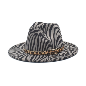 Macro shot of zebra pattern fedora with leopard band and gold buckle detail