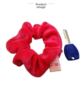 Close-up of rose red velvet hair scrunchie with hidden pocket and high elasticity