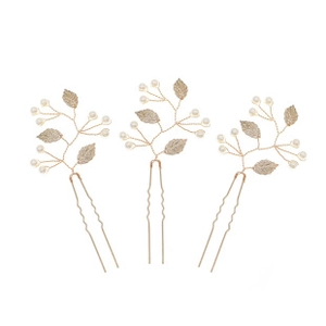 Detailed set of three golden leaf and pearl U-shaped wedding hair pins on white background