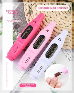 Macro shot of ergonomic nail drill pens in pink and white with speed control dial